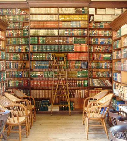 Library with lot of books and chairs