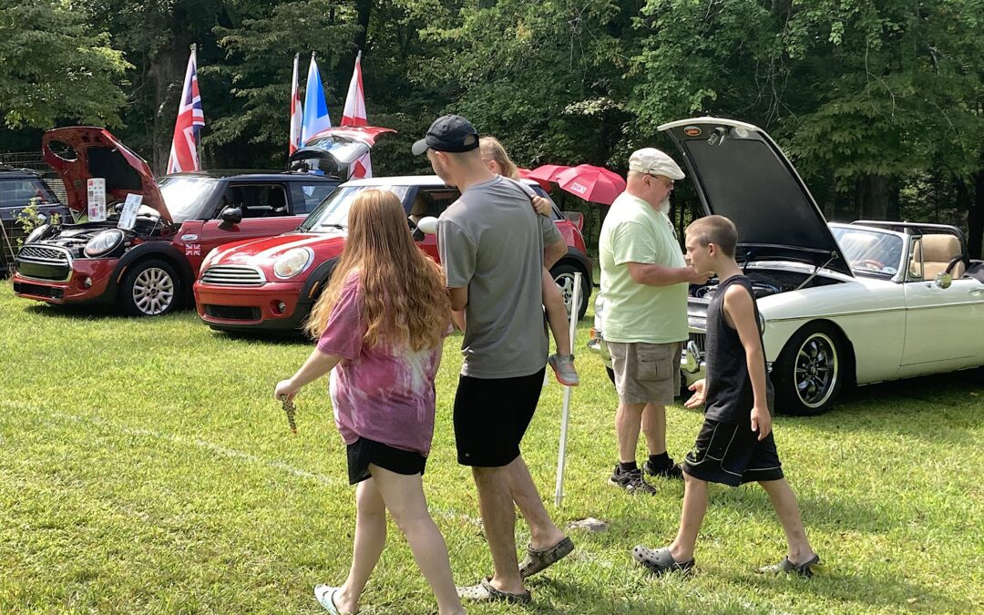 A Group of People With British Flags