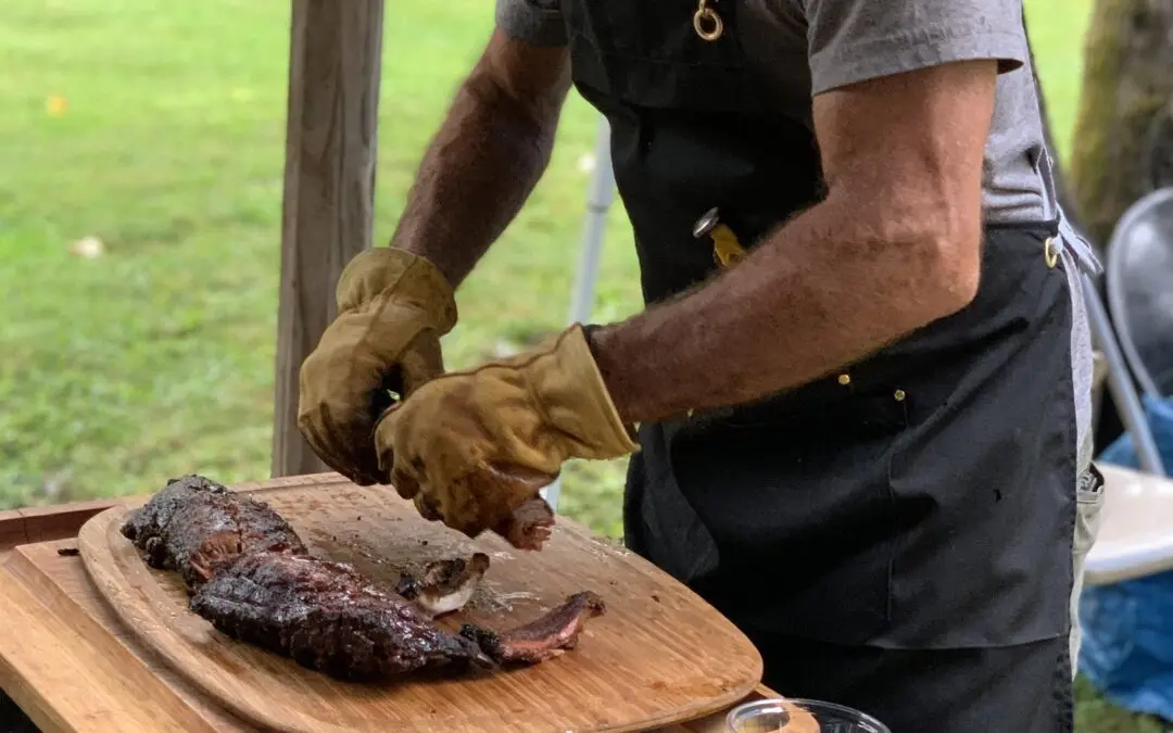Man preparing grilled meat