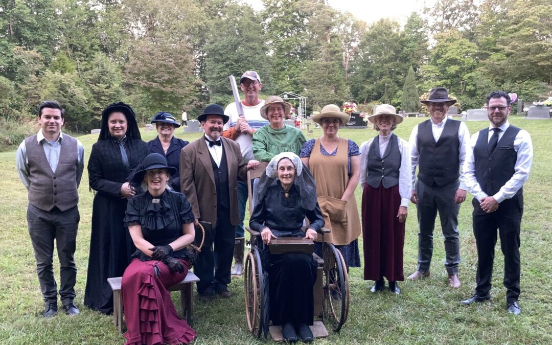 People gathered with different costumes at Cemetery