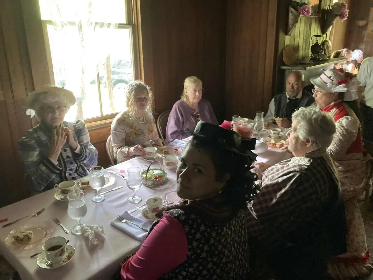 Group of people wearing fashionable dress and taking lunch